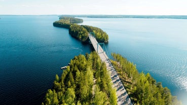 Photo of aerial view of beautiful landscape of lakes and forest in Imatra, Finland.