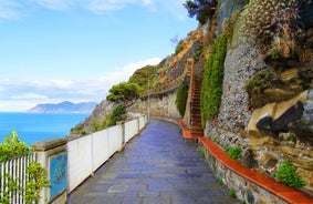 Photo of Riomaggiore with colorful houses along the coastline, one of the five famous coastal village in the Cinque Terre National Park, Liguria, Italy.