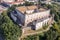 Photo of Aerial panorama view of Zvolen medieval castle with turrets and gate house, outer castle buildings in Slovakia blue cloudy sky background.