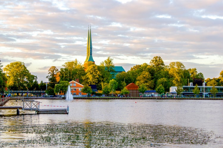 Photo of a scenic and empty wooden pier at the swedish lake Trummen in Vaxjo, in the region Smaland, Sweden.