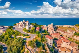 Aerial panoramic cityscape of Rome, Italy, Europe. Roma is the capital of Italy. Cityscape of Rome in summer. Rome roofs view with ancient architecture in Italy. 