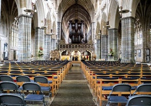 Photo of aerial view of Salisbury cathedral in the spring morning, England.