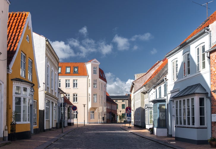 photo of view of Cityscape of Tønder, Southern Denmark (Syddanmark). Traditional danish old town street architecture with white houses, Region of Southern Denmark, Denmark.