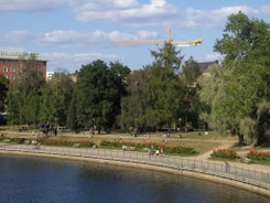 Aerial view of the Tampere city at sunset. Tampella building. View over Tammerkoski river in warm sunlight.