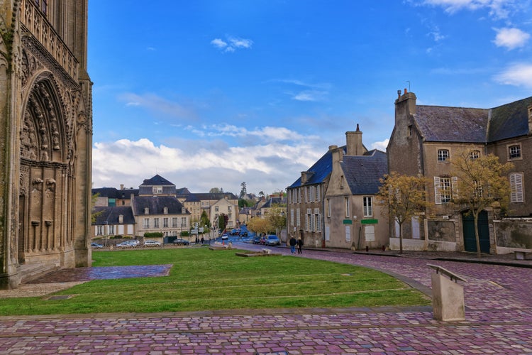 Photo of street and fragment of Cathedral of Our Lady of Bayeux in Calvados department of Normandy, France.