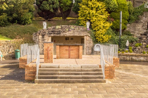 Photo of Outdoor Christian Altar in Carfin Lourdes Grotto, Scotland .