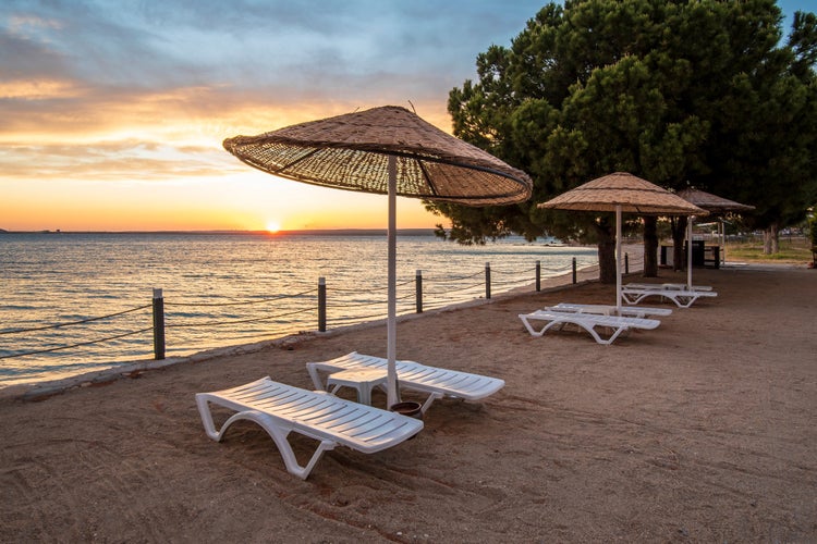 Photo of beautiful sunset at Bozbuk beach in Didim of Turkey.