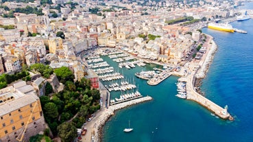 Photo of colorful houses on the shore of Bastia port, bright morning view of Corsica island, France.