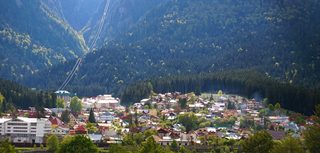 Aerial view over the town of Bușteni in Romania, with the Cantacuzino Castle’s domain in the background. Bușteni is located in the Prahova Valley, at the foot of the Bucegi Mountains.