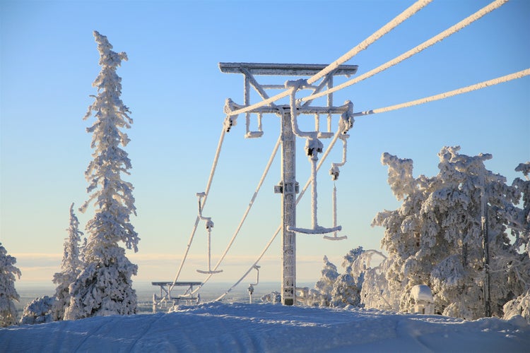 Winter in finish Lapland behind the polar circle. Snow shoe hike on the Keski-Luosto hill near of Sodankylä in the Pyhä-Luosto National Park. At the hill station of the ski lift.