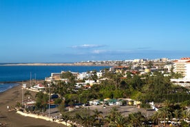 photo of landscape with Maspalomas town and golden sand dunes at sunrise, Gran Canaria, Canary Islands, Spain.