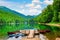 Photo of wooden boats and kayaks near pier on Biogradskoe lake in Montenegro.