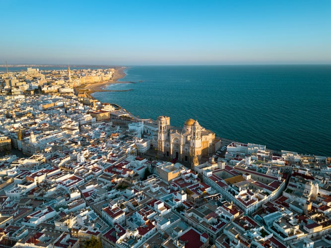 Aerial view of Cadiz city at sunset. View of city center with spectacular Cathedral of Cadiz in the middle..jpg