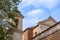 photo of Side View with the Bell Tower of the Basilica of San Clemente in the Center of Rome on a Background of Partly Cloudy Sky,Rome Italy.