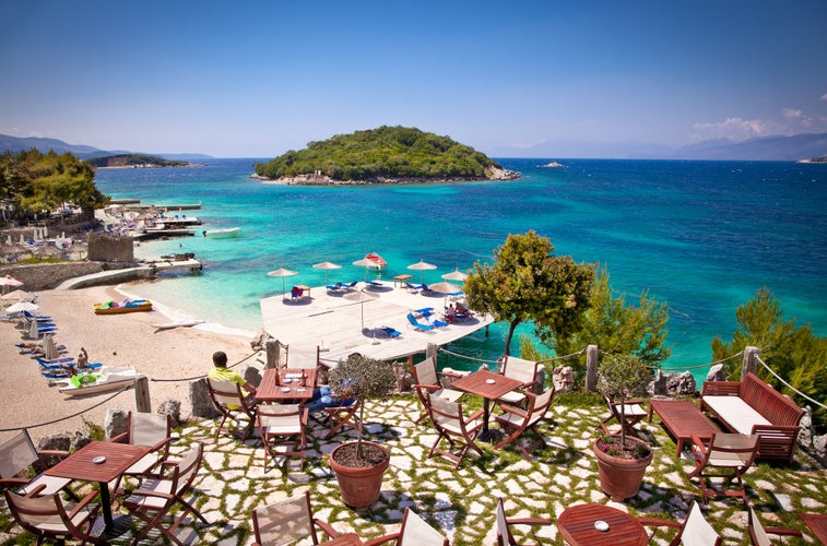 Sunshade umbrellas and deckchairs on the beautiful Ksamil beach, Albania.