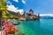 photo of Oberhofen Castle at Lake Thunersee in swiss Alps, Switzerland. Schloss Oberhofen on the Lake Thun (Thunersee) in Bern Canton of Switzerland. Oberhofen castle on Lake Thun, Switzerland.