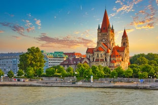 Photo of Lednice Chateau with beautiful gardens and parks on a sunny summer day, Czech Republic.