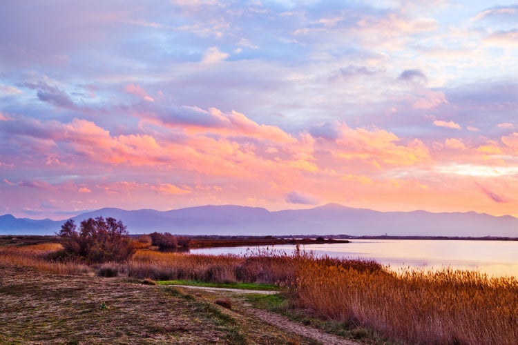 Photo of cloudy winter sunset at "Etang de Canet-Saint Nazaire" lake, Perpignan city,