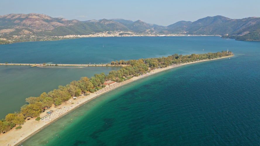 photo of Igoumenitsa Beach Drepanos sand and sea waves under the blue sky tourist place and attraction beautiful in Igoumenitsa city Greece Thesprotia close to Parga Preveza and Sivota Epirus Europe seascape.