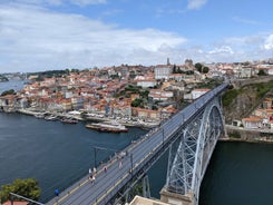 Porto, Portugal old town ribeira aerial promenade view with colorful houses, Douro river and boats.