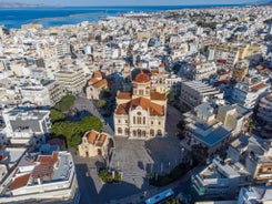 Photo of aerial view of Chania with the amazing lighthouse, mosque, venetian shipyards, Crete, Greece.