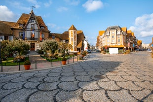 photo of Port of Deauville and city skyline in a sunny summer day, Normandy, France.