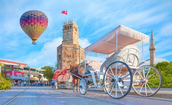 Hot air balloons flying over Uchisar Castle. Cappadocia. Nevsehir Province. Turkey.