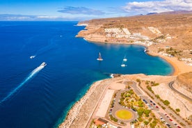 photo of landscape with Maspalomas town and golden sand dunes at sunrise, Gran Canaria, Canary Islands, Spain.