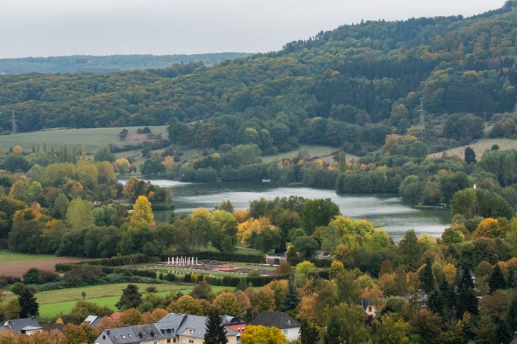 Photo of Lake in Echternach - Luxembourg - with ruins of Roman villa in front .