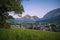 Photo of beautiful early morning view on Gröbming village from a fresh grassy hillside with alpine mountains in the background ,Austria.