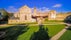 Photo of the old ruined Haapsalu castle in Estonia. It has a green grassland outside the ruined castle.