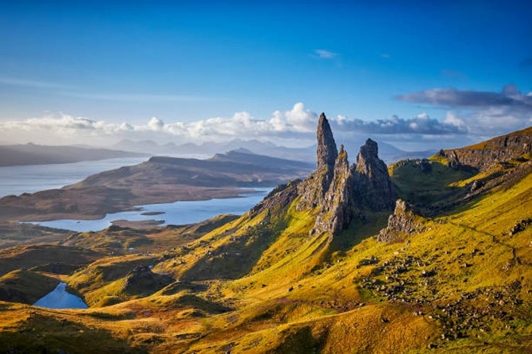 A breathtaking view of the Old Man of Storr on the Isle of Skye, Scotland, bathed in the warm, golden light of a beautiful sunrise.jpg