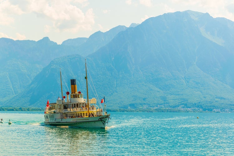 Photo of passenger ferry arriving to the pier at port at Vevey, Switzerland.