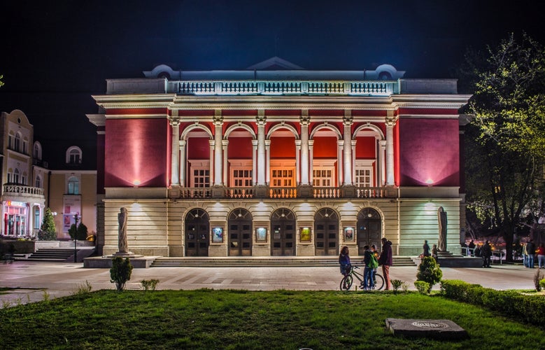 night view over building of bulgarian national opera house in rousse - ruse.