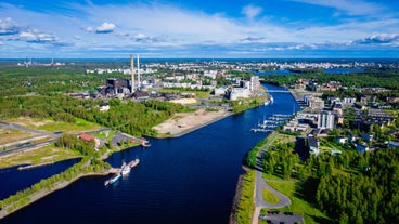 Early autumn morning panorama of the Port of Turku, Finland, with Turku Castle at background.