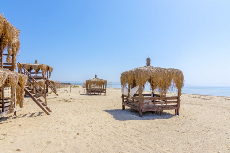 Photo of Sarimsakli beautiful beach with sunbeds, Ayvalik.