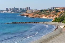 photo of aerial panoramic drone point of view Cabo Roig coastline with blue Mediterranean Seascape view, residential buildings near sandy beach at sunny summer day. Province of Alicante, Costa Blanca. Spain.