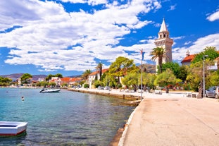 photo of a beautiful panoramic view of Kastel Luksic harbor and landmarks summer view, Split region of Dalmatia, Croatia.