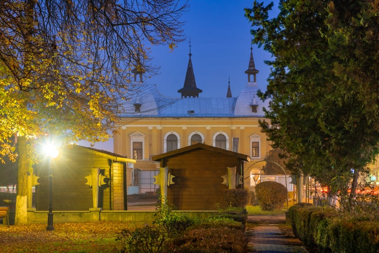 photo of view of Central park illuminated at night in autumn season in Sighetu Marmatiei, Romania.