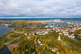 Aerial view of the Tampere city at sunset. Tampella building. View over Tammerkoski river in warm sunlight.