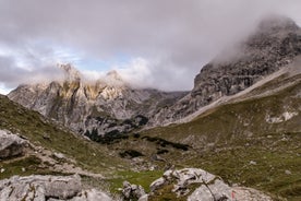 Photo of a view of the Alps from the Ehrwald, a town on the border of Germany and Austria with picturesque meadows surrounded by towering mountain ranges, including the Zugspitze.