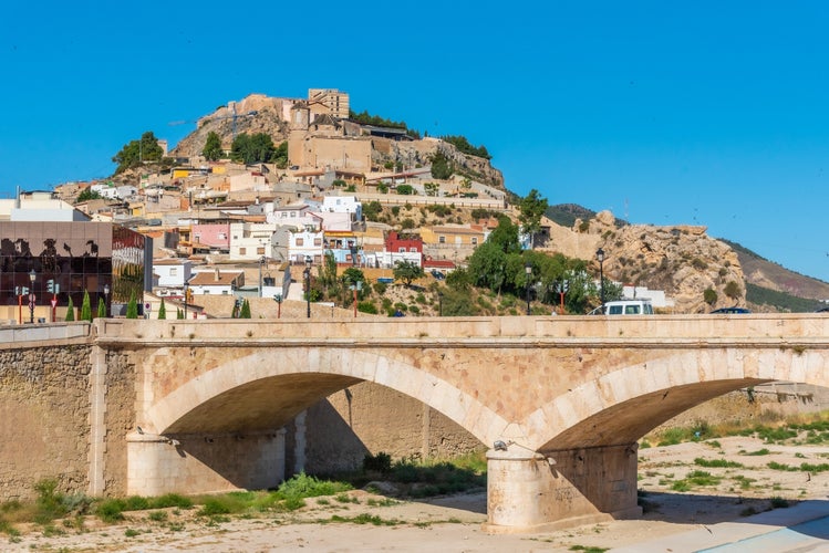 Photo of Lorca castle viewed from behind Guadalentin river, Spain.