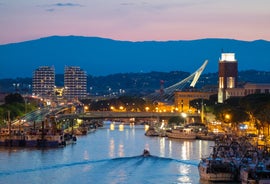 Photo of aerial view of Verona historical city centre, Ponte Pietra bridge across Adige river, Verona Cathedral, Duomo di Verona, red tiled roofs, Veneto Region, Italy.