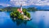 Bled, Slovenia. Amazing Bled Lake, island and church with Julian Alps mountain range background, Europe spotlight.