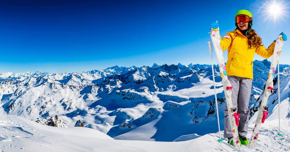 photo of ski teenager sporty girl having fun on winter vacation on the slope, 4 valleys, Mt Fort, Verbier, Switzerland.