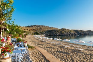 Photo of panoramic aerial view of Lindos bay, village and Acropolis, Rhodes, Greece.