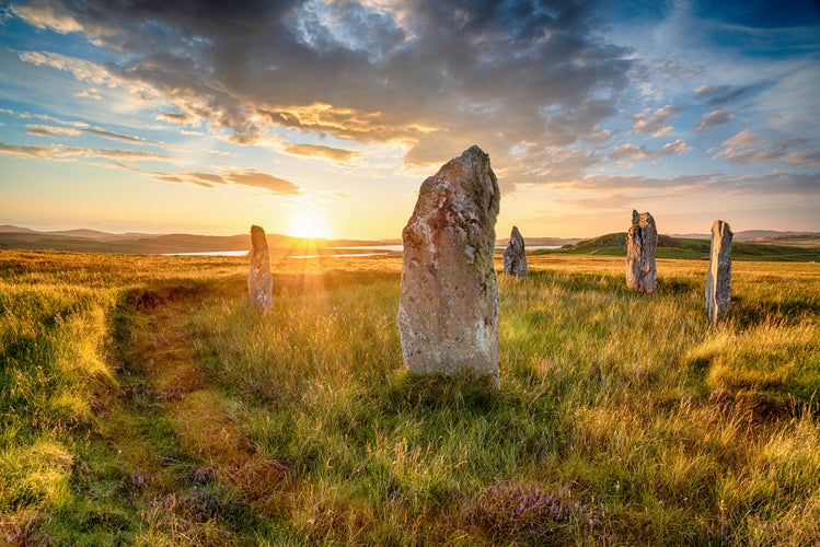 photo of Dramatic sunset over Ceann Hulavig stone circle on the Isle of Lewis in  Stornoway ,the out Hebrides of Scotland, also known as Callanish 4.