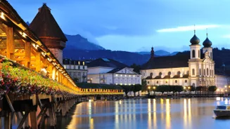 Panoramic view of historic Zurich city center with famous Fraumunster, Grossmunster and St. Peter and river Limmat at Lake Zurich on a sunny day with clouds in summer, Canton of Zurich, Switzerland