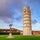 photo of medieval leaning tower of pisa (Torre di pisa) at piazza dei miracoli (Piazza del duomo), Tuscany, Italy.