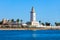 Photo of Lighthouse in the port of Malaga. Malaga is a city in the Andalusia community in Spain.